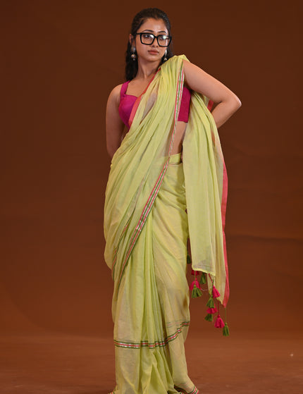 Yellow Mulmul Saree With Dual Tone Border And Tassels