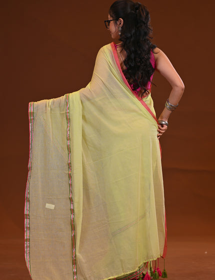 Yellow Mulmul Saree With Dual Tone Border And Tassels