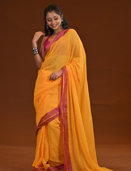 Yellow Mulmul Cotton Saree With Pink Border