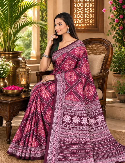 Magenta ikat silk saree draped seated, showing lustrous mercerised weave and printed pallu - KalamKantha

