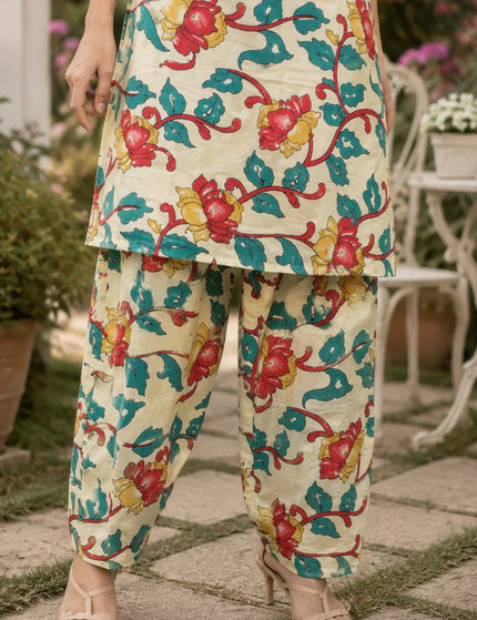 Lower front detail of the ivory floral kurta hem over matching printed Patiala pants
