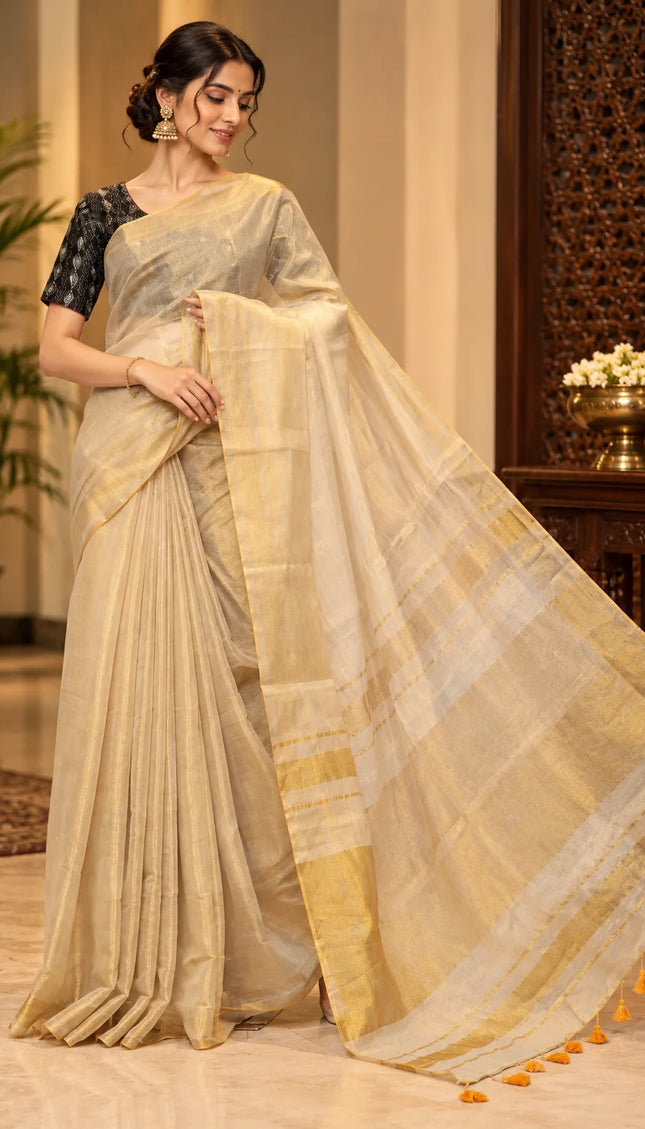 Ivory Mull cotton saree with golden border and pallu spread to show its sheer drape