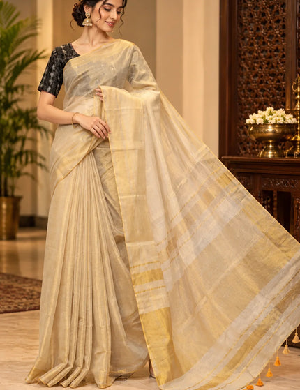 Ivory Mull cotton saree with golden border and pallu spread to show its sheer drape