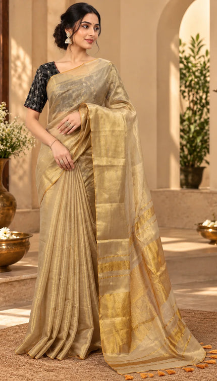 Front view of ivory Mull cotton saree with golden zari border and tasseled pallu