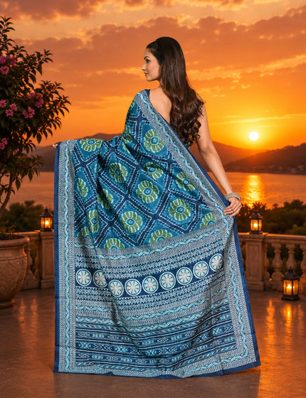 Teal ikkat silk saree back view, pallu spread showing green medallion motifs and circular border band - KalamKantha